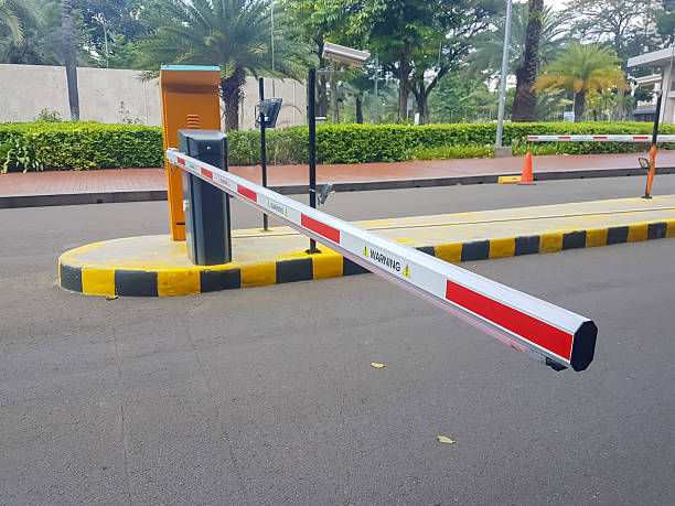 an automatic boom barrier, a system commonly used to control vehicle access at entry and exit points.