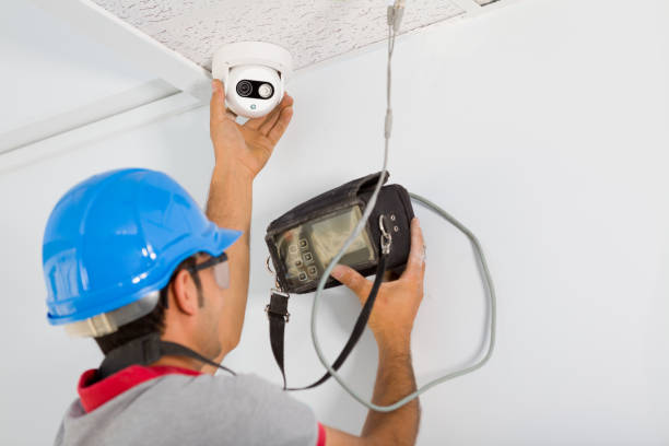 Security camera service man working.